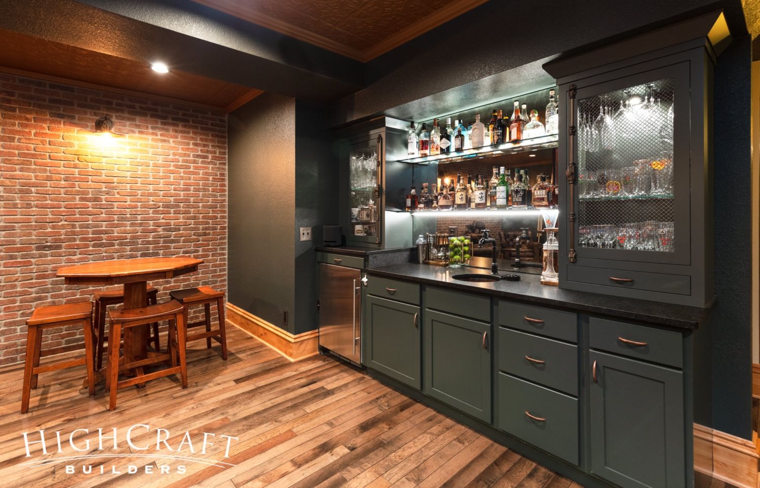 Basement finish fort collins speakeasy wet bar seating brick wall 