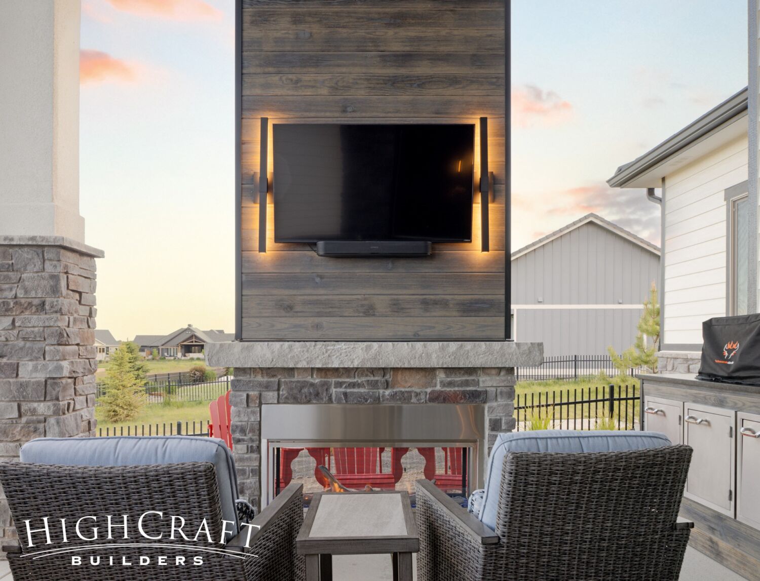 Berthoud remodel outdoor fireplace backlit TV stone mantel