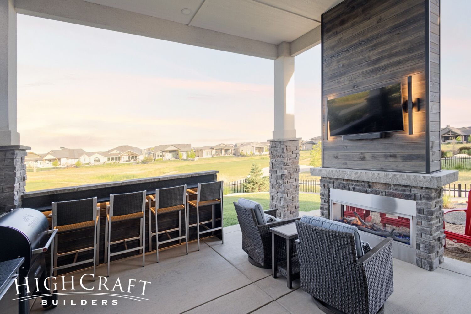 Berthoud remodel outdoor living underlit bar fireplace seating