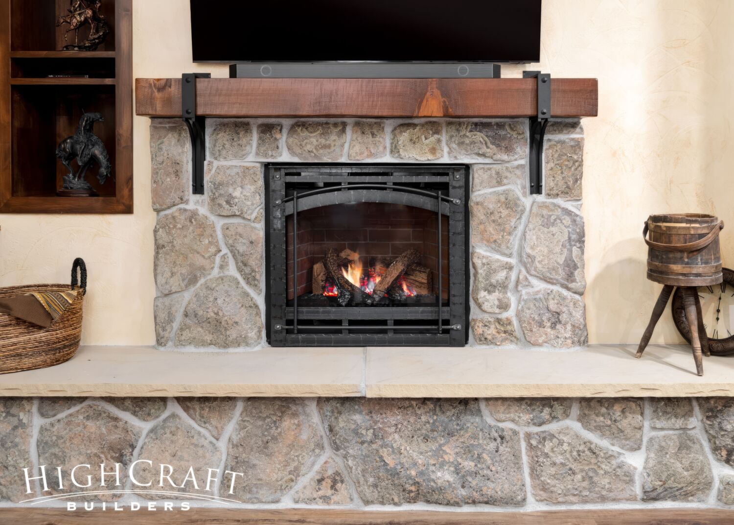 basement-remodel-Fort-Collins-moss-rock-fireplace-rough-sawn-mantel