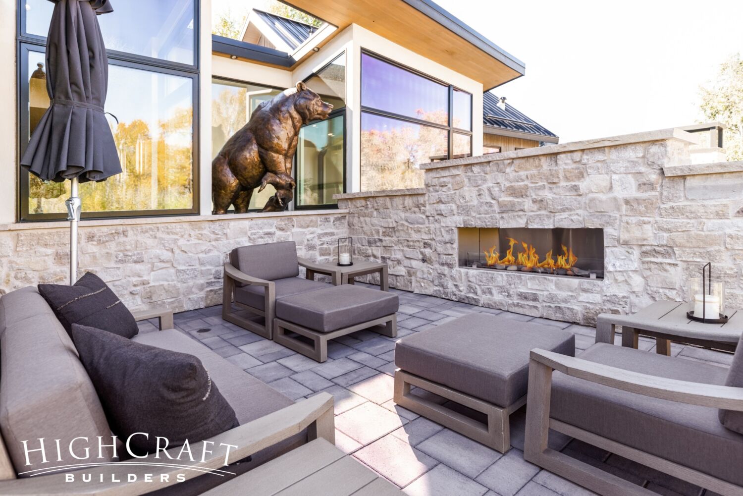 custom-home-builder-Fort-Collins-stone-wall-private-terrace-lounge-fireplace