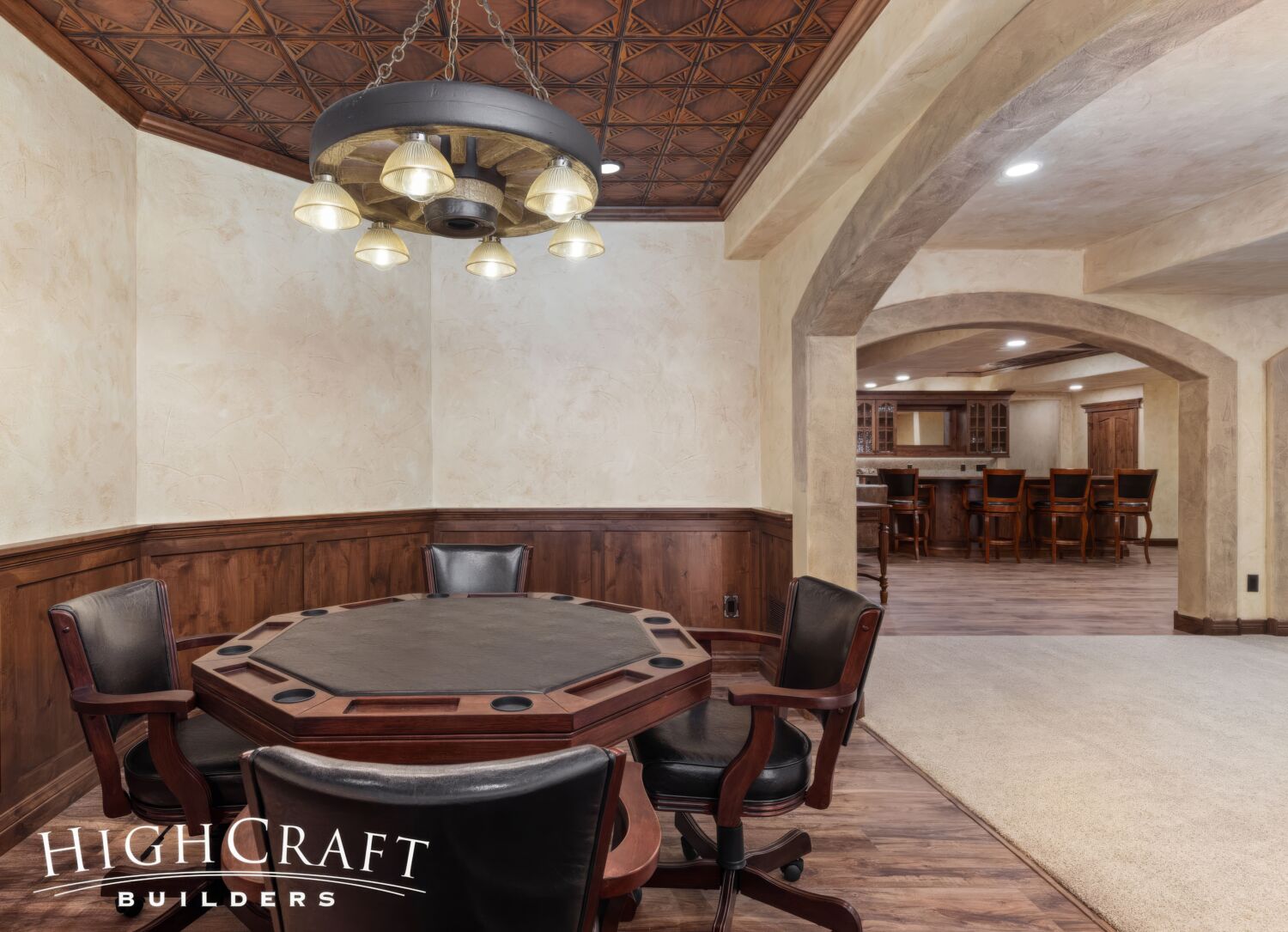 basement-remodel-poker-room-wagon-wheel-light