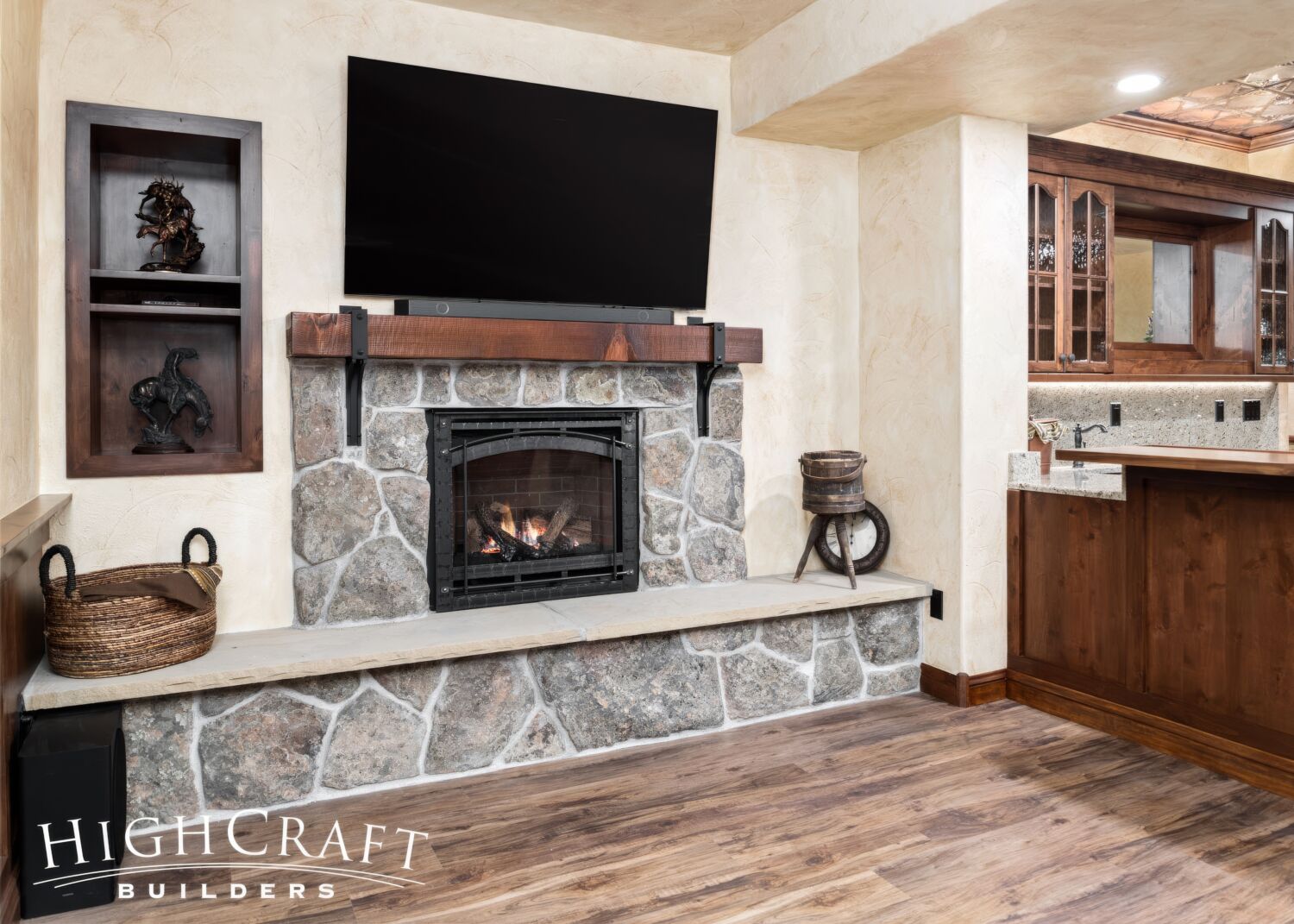 basement-remodel-stone-fireplace-tv-wood-wall-niche-detail