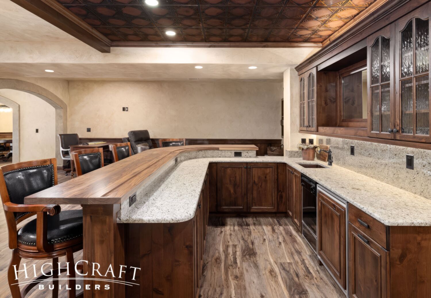 basement-remodel-wet-bar-curved-bar-top-granite-counter